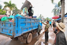 Waste collection by a private company in the city center, Xay District